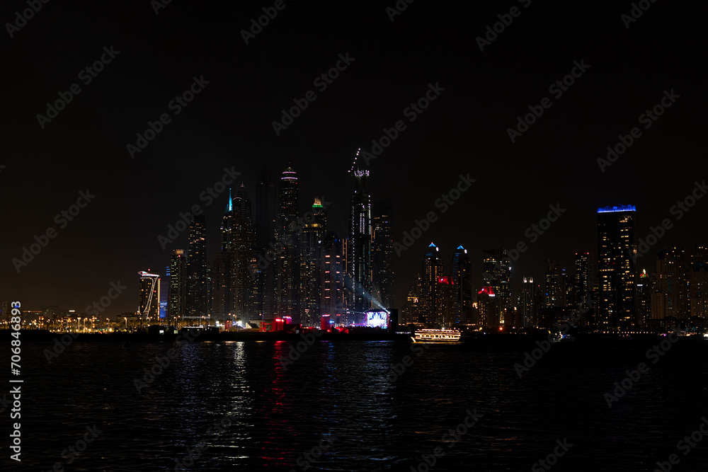 Beautiful night view of Dubai skyscrapers from the sea. Night panorama of Dubai Marina Beautiful night view of Dubai skyscrapers from the sea. Night panorama of Dubai Marina