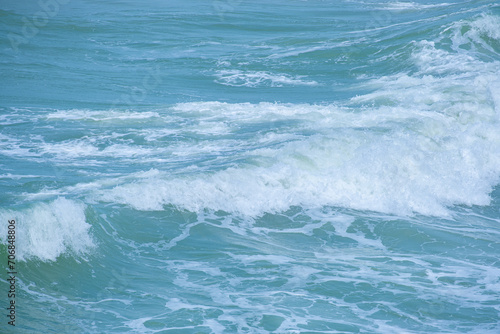 summer sea water blue surface Clear water with ripples and foam. The sunlight shone brightly. 