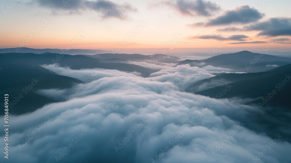 Beautiful sunrise over the clouds and mountains
