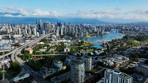 Pullback Flight Above South Granville With View Of False Creek And Granville Bridge In Vancouver, BC, Canada. aerial shot photo
