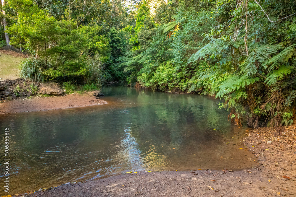 A peaceful river called the North Johnstone River disappears into the tropical rainforest after flowing through the town of Malanda on the Atherton Tablelands in tropical Queensland, Australia. A peaceful river called the North Johnstone River disappears into the tropical rainforest after flowing through the town of Malanda on the Atherton Tablelands in tropical Queensland, Australia.