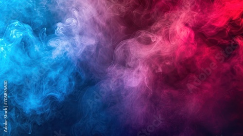 Dense multicolored smoke of  red  blue and pink colors on a black isolated background.
