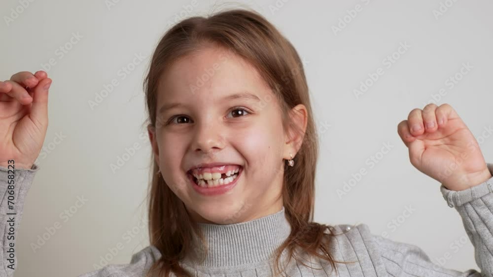 Happy smiling cute girl dancing with raised hands Happy smiling cute girl dancing with raised hands