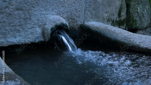 Burga of hot thermal water bubbles into catchment basin in Baños de Molgas, Ourense, Galicia, Spain photo