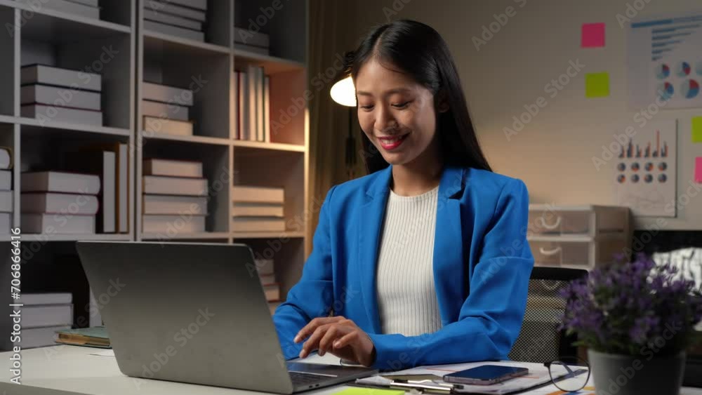 Asian businesswoman shows smiling and relaxed expression while completing task. successful Happy to use a laptop computer to communicate and receive information on online business in the office. Asian businesswoman shows smiling and relaxed expression while completing task. successful Happy to use a laptop computer to communicate and receive information on online business in the office.