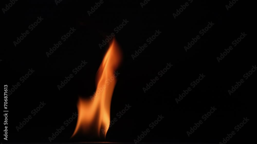 Hot flames on a black background. Beautiful flame of fire in the dark. Abstract of burning flames and smoke. Hot flames on a black background. Beautiful flame of fire in the dark. Abstract of burning flames and smoke.