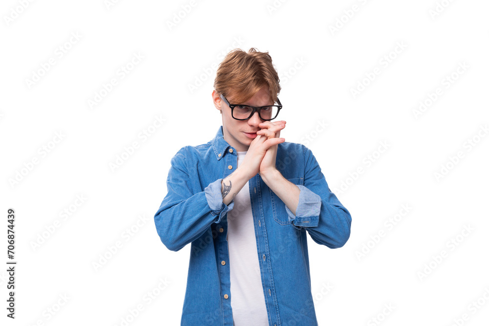 portrait of a young european guy with red hair in a blue shirt and white t-shirt closeup portrait of a young european guy with red hair in a blue shirt and white t-shirt closeup
