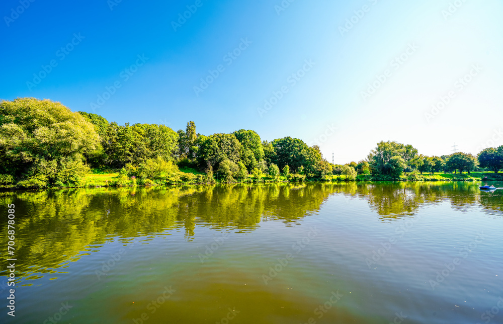 Fototapeta premium View of Lake Kemnader and the surrounding nature. Landscape at the Ruhr reservoir in the Ruhr area. 