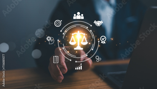 Obraz na płótnie Business ethics concept. Ethical investment, sustianable development. Business integrity and moral. Businessman touching on BUSSINESS ETHICS wording on smart screening surrounded by ethical elements. w salonie