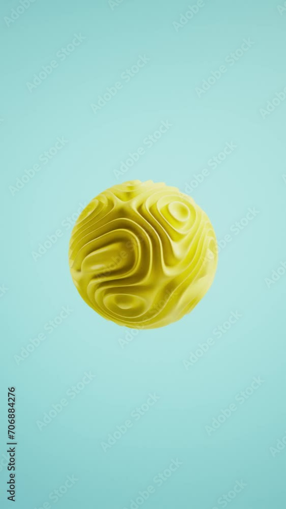 waves appearing and disappearing on a yellow ball.