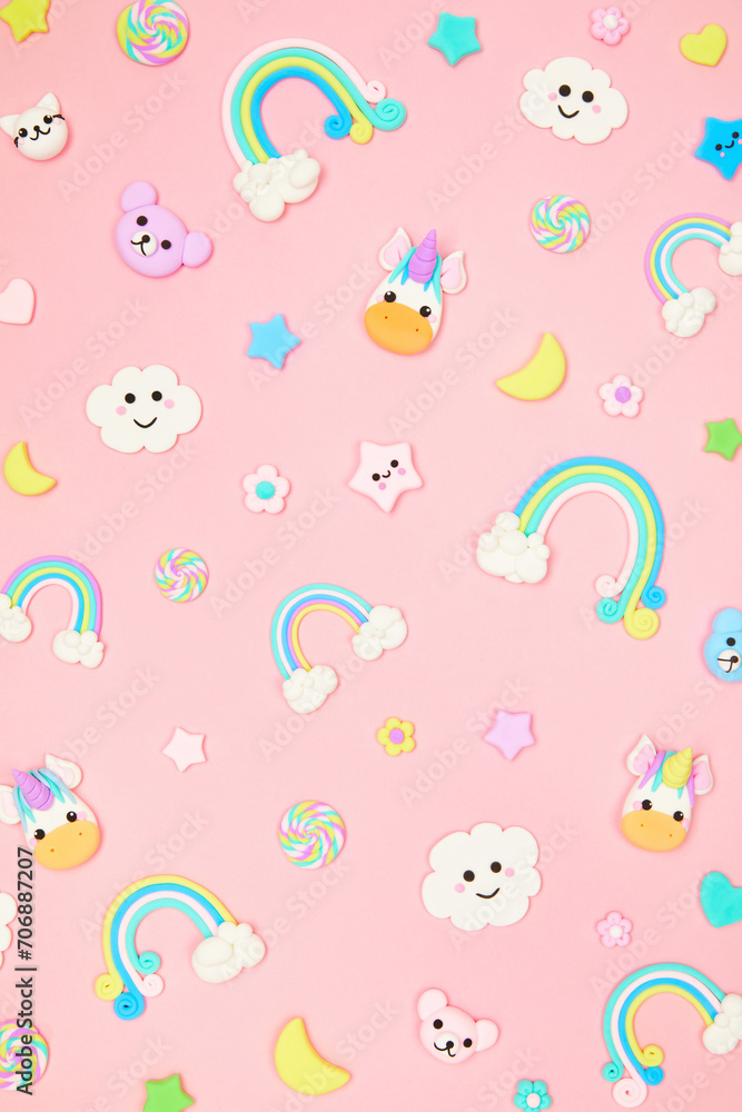 Trendy pastel pink kawaii background with cute air plasticine handmade cartoon animals, unicorns, stars, rainbows pattern. Top view, flat lay. Candycore, fairycore.