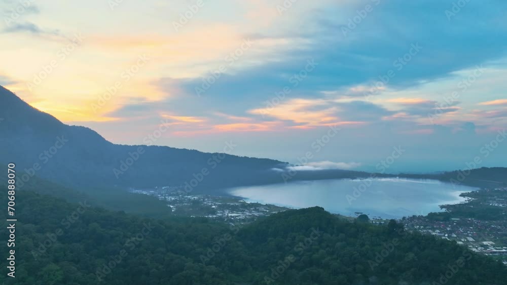 sunrise over the mountains and lake view. Beratan Lake View From Above in the morning sunrise over the mountains and lake view. Beratan Lake View From Above in the morning