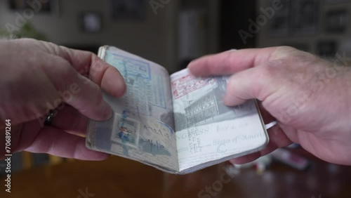 A passport full of stamps and visas after a lifetime of travel - close up photo