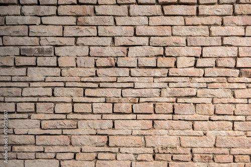 An old brick wall textured and pattern. A brick is a type of block used to build walls.
