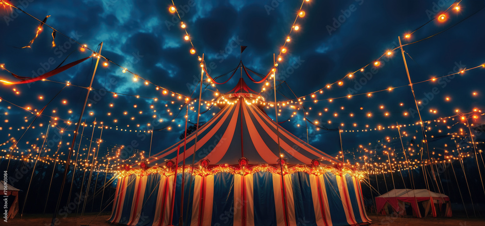 Naklejka premium Circus canopy decorated with lights at night with copy space