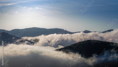 Photograph of white fog with mountains on the side