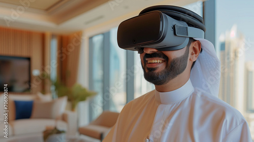 Arab Millionaire Sheikh in Traditional Attire Wearing VR Glasses, smiling  © tiagozr