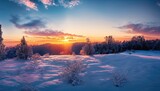 Fantastic winter landscape during sunset. colorful sky glowing by sunlight