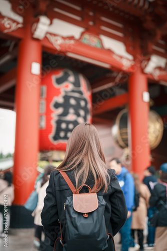 Tourist woman visit Sensoji Temple or Asakusa Kannon Temple is a Buddhist temple located in Asakusa  Tokyo Japan. Japanese sentence on red lantern means Thunder gate.