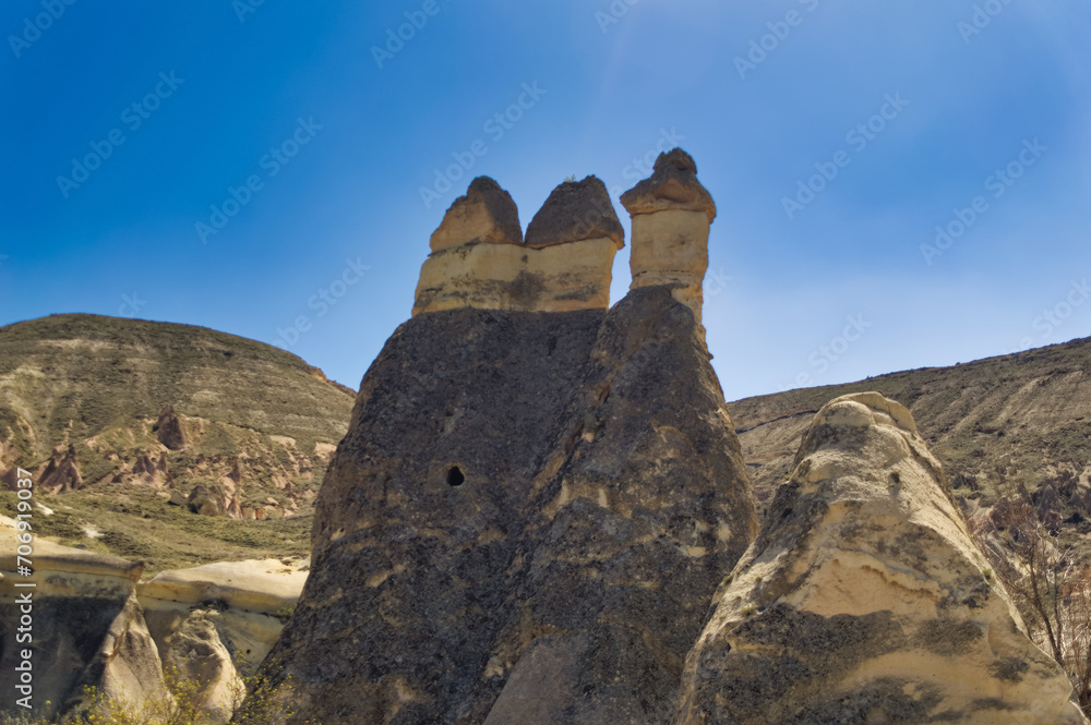 Cappadocia landscape soft volcanic rock, shaped by erosion into towers.