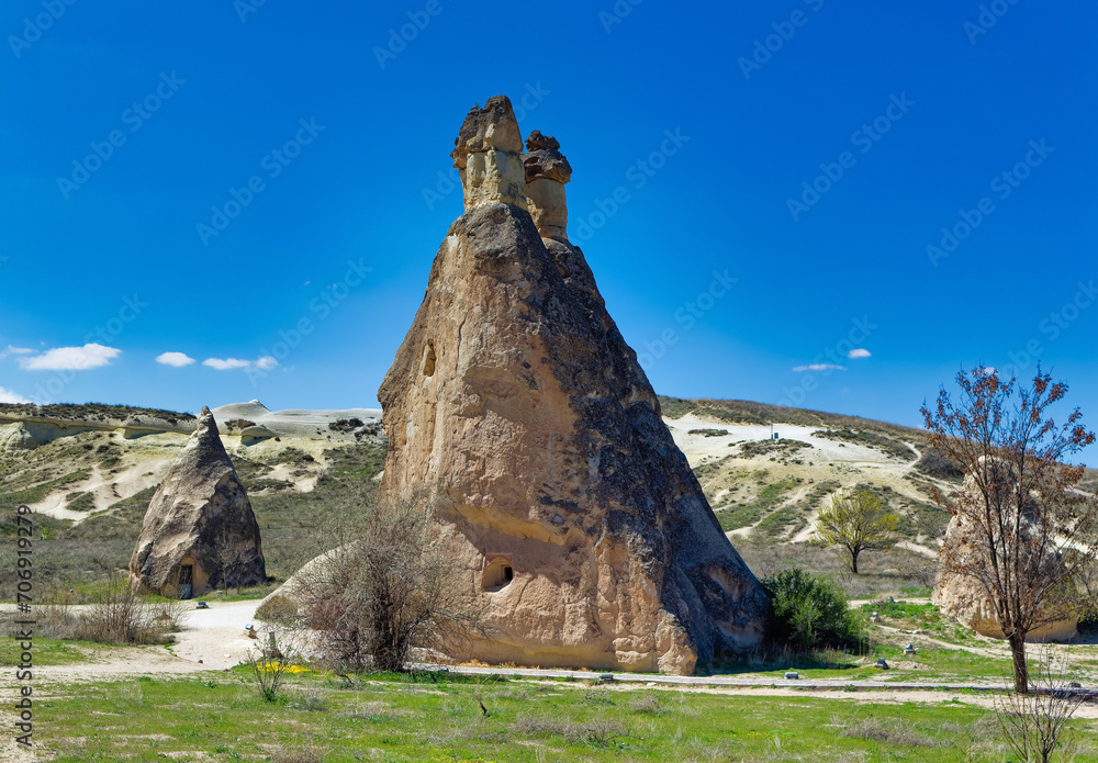 Cappadocia landscape soft volcanic rock, shaped by erosion into towers.