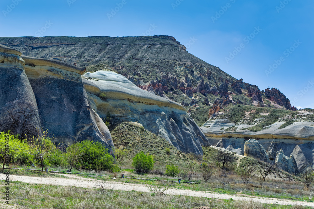 Cappadocia landscape soft volcanic rock, shaped by erosion into towers.