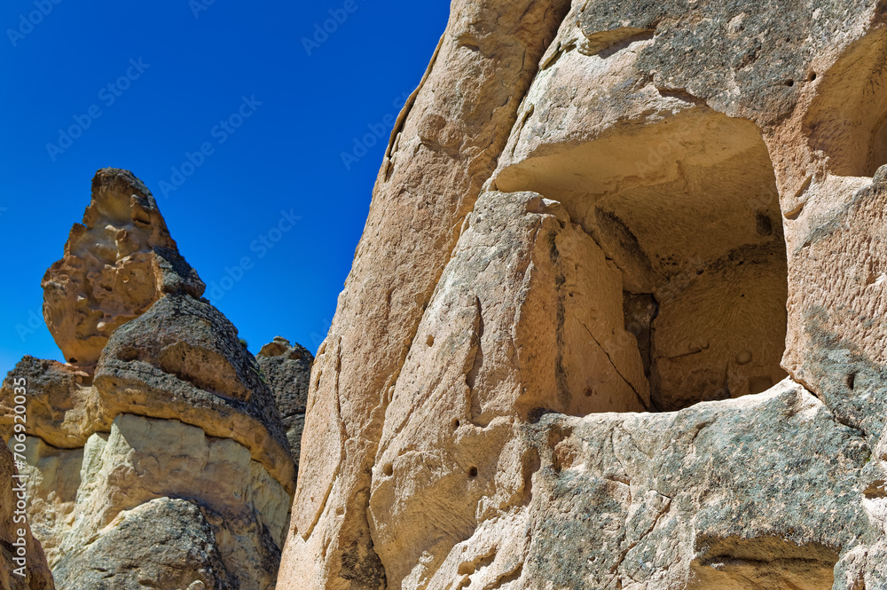 Cappadocia landscape soft volcanic rock, shaped by erosion into towers.