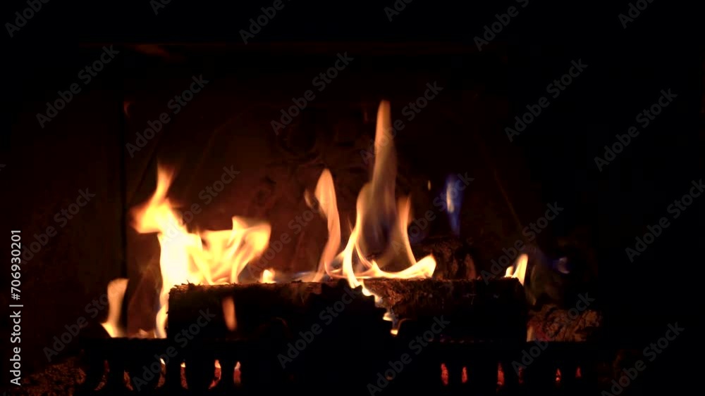 Burning fire in fireplace. Slow motion hot flames. Burning fire in fireplace. Slow motion hot flames.