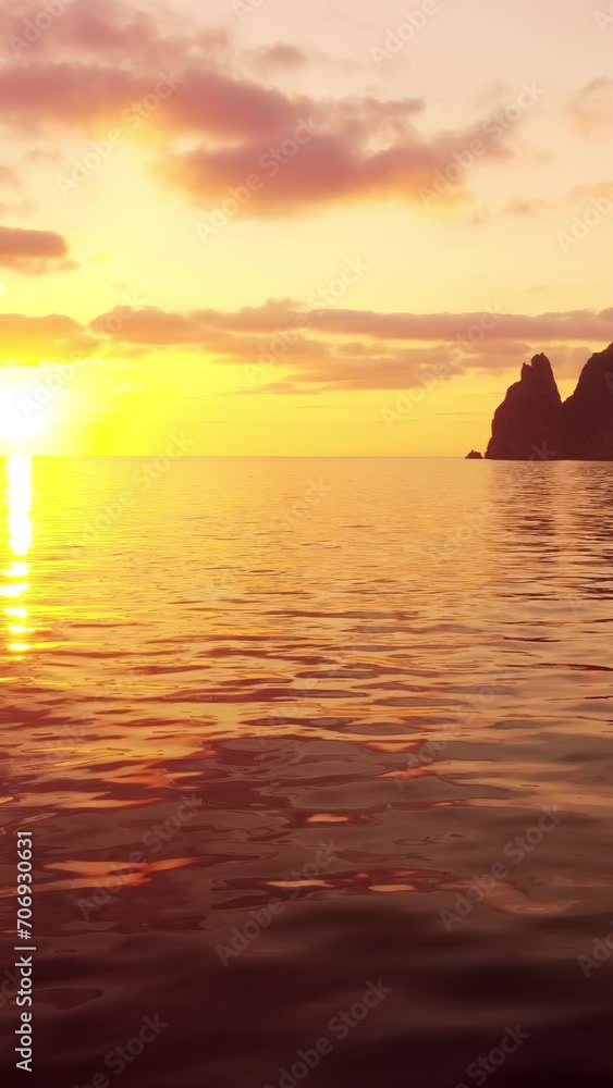 Sea water surface at sunset. Vertical aerial view, camera flies over calm golden sea. Sun glare. Abstract nautical summer ocean nature. Holiday and travel concept. Nobody. Weather and climate change Sea water surface at sunset. Vertical aerial view, camera flies over calm golden sea. Sun glare. Abstract nautical summer ocean nature. Holiday and travel concept. Nobody. Weather and climate change