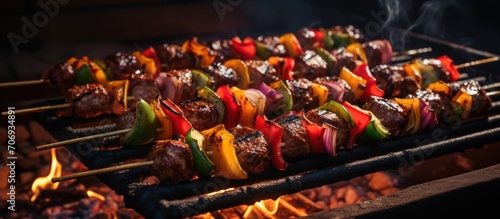 meat skewers with vegetables cooked on a barbecue grill