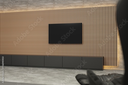 Flat screen TV on acoustic panel covered wall. Clean minimalist interior. Ambient lighting around acoustic panelling. Wide side shot. Template for TV creative