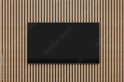 Flat screen TV on acoustic panel covered wall. Clean minimalist interior. Close up shot. Template for TV creative