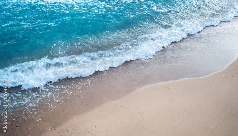 Beautiful soft blue ocean waves on a sandy beach in summer. Vacation concept background.
