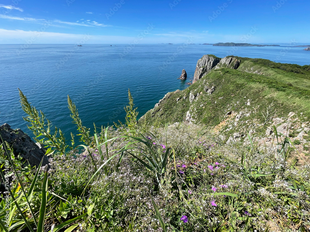 The beautiful Southeastern coast of the island of Shkota in August in sunny weather. Russia, Vladivostok city