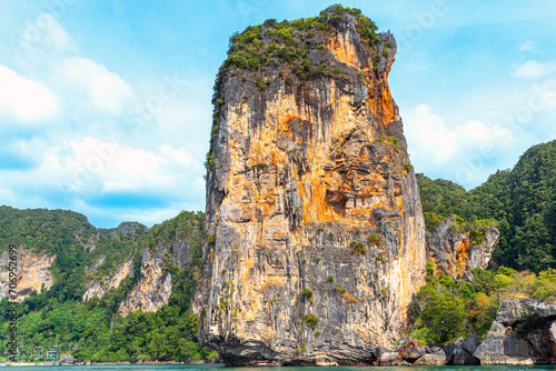 The Ao Nang tower, a solitary sea stack between Ao Nang beach and Rai Leh in the Krabi province. This crag is only accessible by water so a long-tail boat ride, kayak or paddleboard is required photo