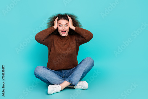 Full body photo of attractive young woman touch head excited astonished wear trendy brown clothes isolated on cyan color background © deagreez