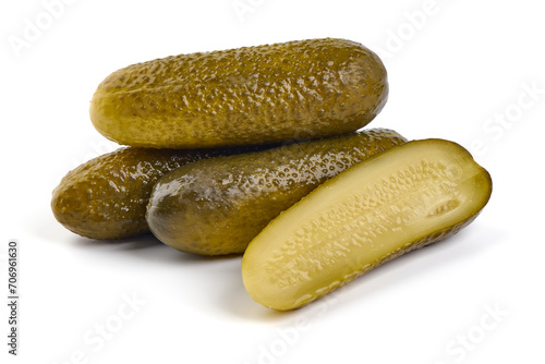 Marinated pickled cucumbers, gherkin, salted cornichon, isolated on white background.