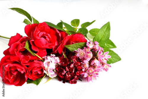 A bright bouquet of red roses on a white background makes an excellent greeting card.