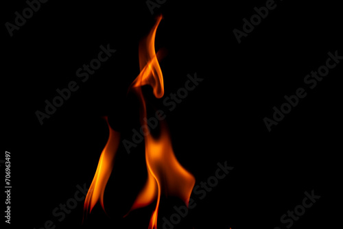 Hot flames on a black background. Beautiful flame of fire in the dark. Abstract of burning flames and smoke. © scentrio