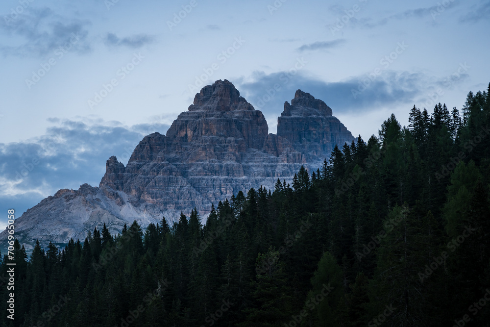 Three peaks in the Dolomites in the Italian Alps at dawn with pine trees in the foreground near lake Misurina Three peaks in the Dolomites in the Italian Alps at dawn with pine trees in the foreground near lake Misurina