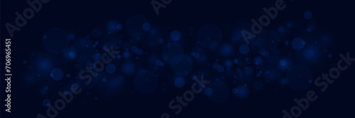 Blue bokeh background with defocused circles and sparkles. Light flare effect with dust particles. photo