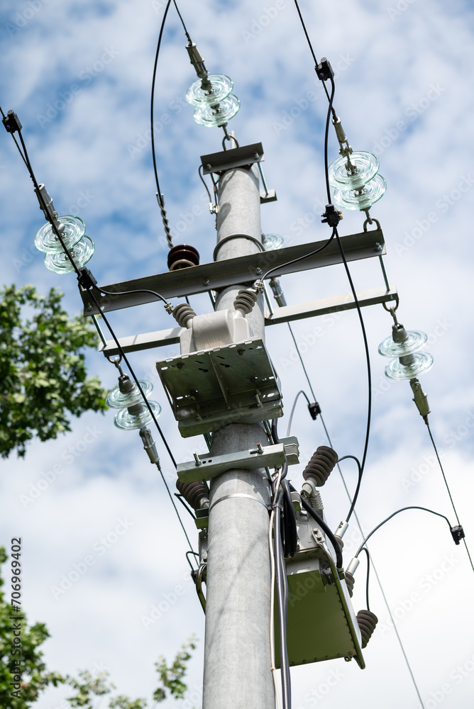 Modern electric pole with equipment. Providing electricity for consumers with new electric equipment Modern electric pole with equipment. Providing electricity for consumers with new electric equipment