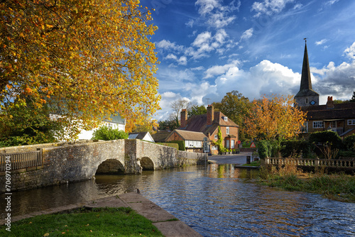 Eynsford a Village in Kent near Sevenoaks with a stone medieval bridge and Church and a ford through the shallow river for larger vehicles to cross.