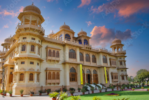 Grand Traditional Indian Palace at Dawn or Dusk, Rajasthan, with Ornate Domes and Lush Gardens