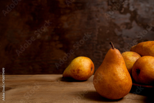 Pears on wooden background as background image..