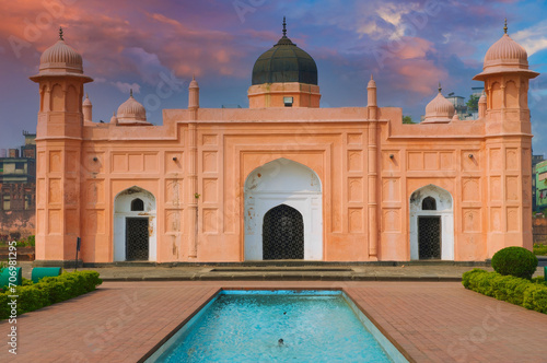 Twilight Hues at South Asian Historical Site with Reflecting Pool, Symmetrical Domes, and Intricate Carvings photo