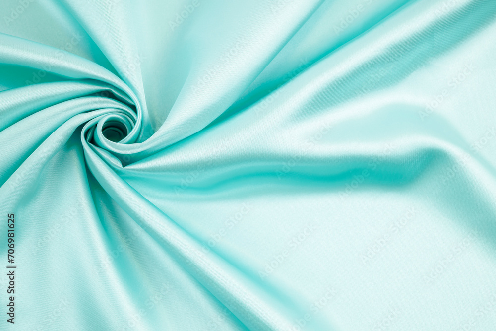 Fototapeta premium Abstract background texture. Light green silk or liquid with soft waves.