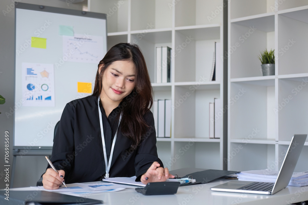 Business woman using calculator for do math finance on wooden desk in office and business working background, tax, accounting, statistics and analytic research concept. Business woman using calculator for do math finance on wooden desk in office and business working background, tax, accounting, statistics and analytic research concept.