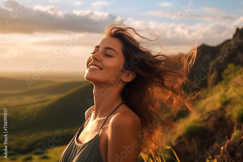 happy woman with windblown hair admires a scenic, green landscape under a cloudy sky during the golden hour, ai generative © larrui