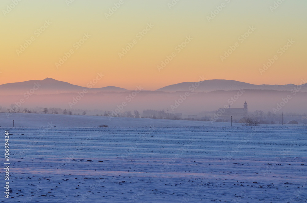 Naklejka premium beautiful cold January day, view of the sunrise over the mountains, Bolatice, Czech Landscape, 
